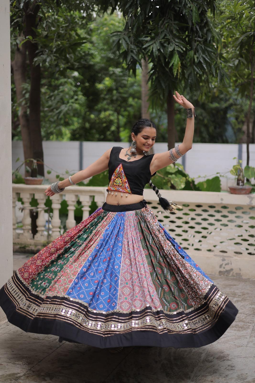 Woman in traditional outfit with a colorful skirt dancing outdoors.